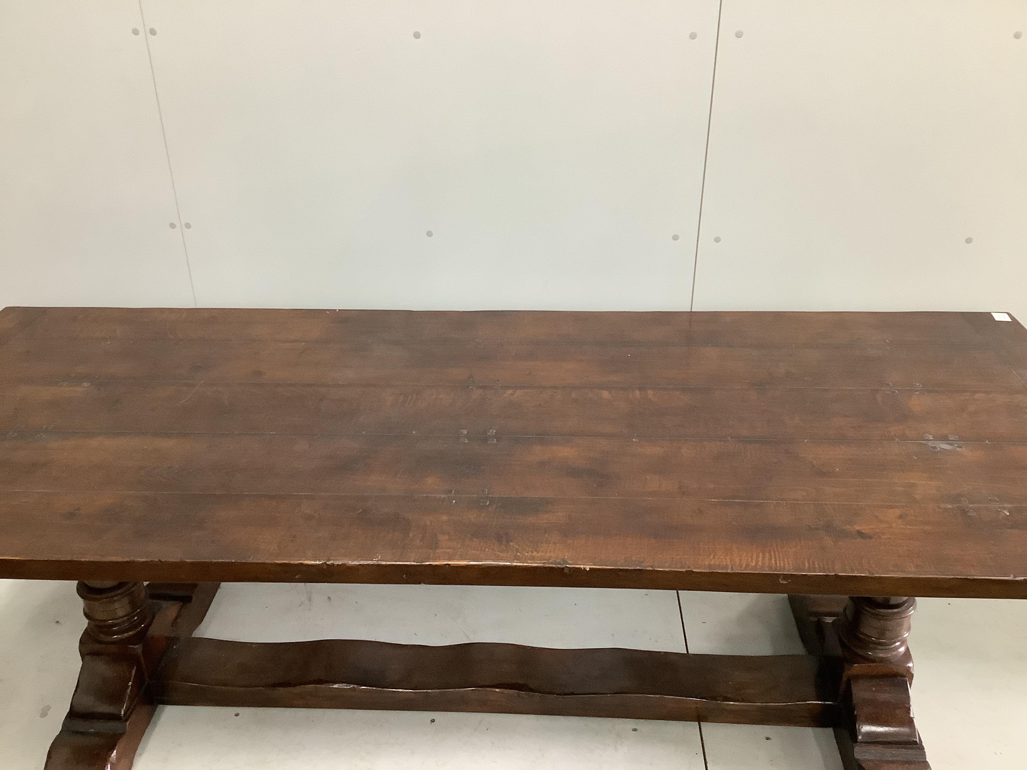 A 17th century style rectangular oak refectory dining table, width 228cm, depth 90cm, height 76cm